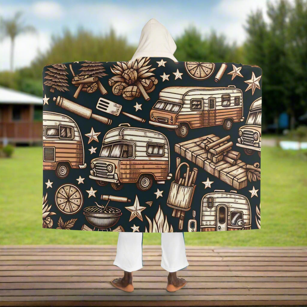 Person wearing a blanket with vintage camper and wood pattern